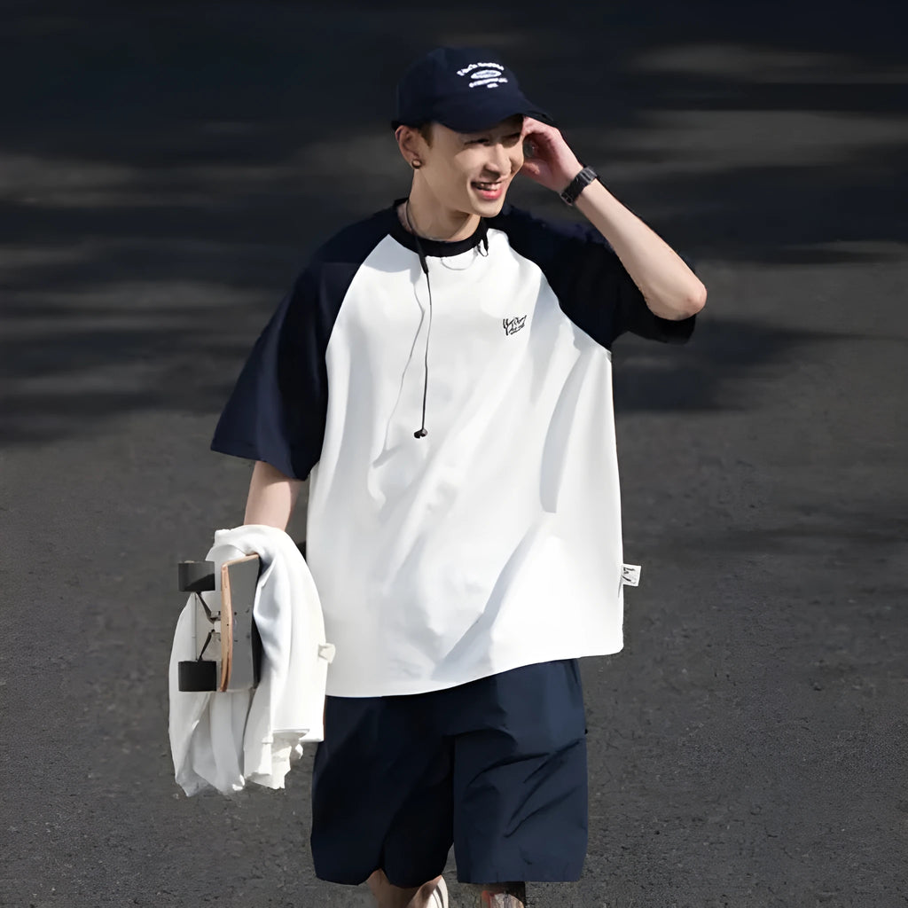 Blue Japanese-style loose men's t-shirt with raglan sleeves on a hanger