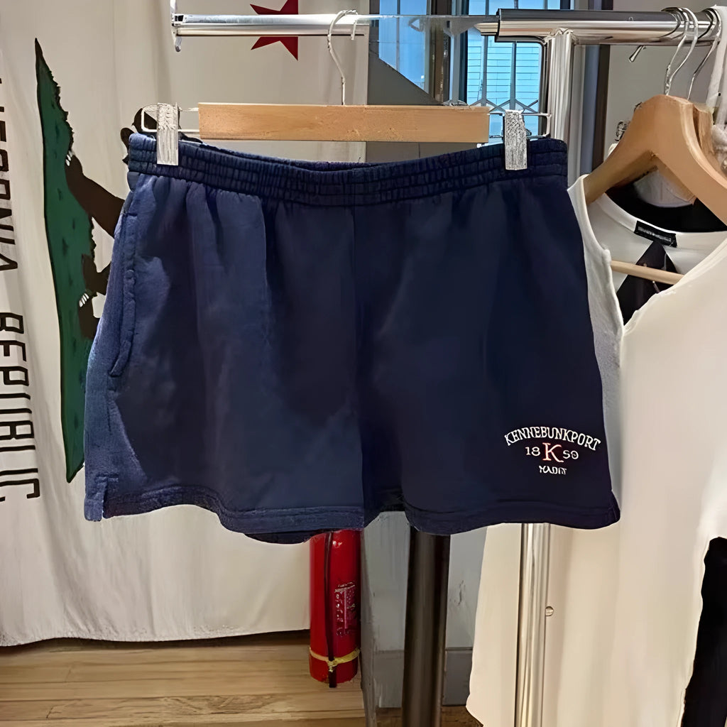 Women's dark blue cotton sports shorts with white flag embroidery and navy blue styling