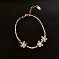Gold-tone copper bracelet with geometric shapes and zircon stone detailing for women's fashion
