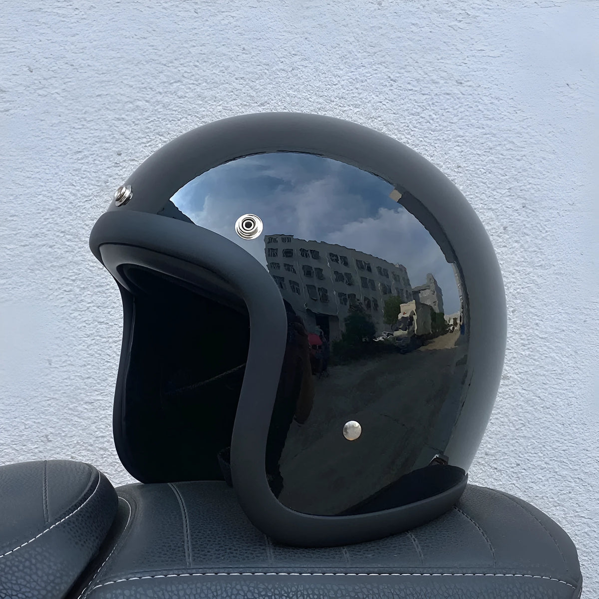 Glass fibre retro motorcycle half helmet shown in cement grey colour on size M