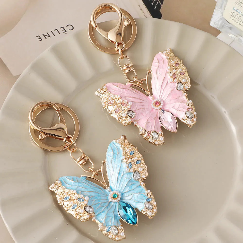 Enamel dripping oil butterfly brooch keychain in pink or blue, dual purpose European style metal accessory.