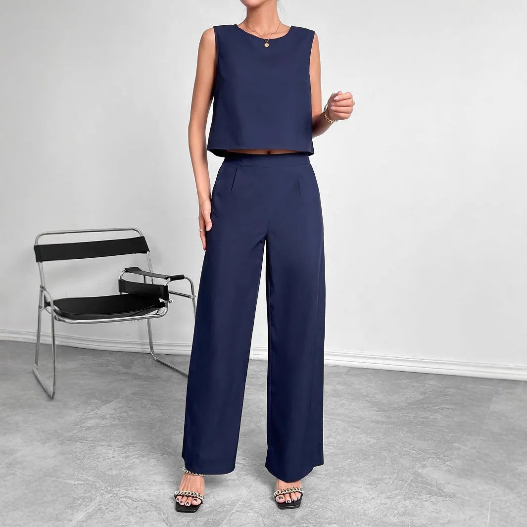 Women's red polyester two-piece set with sleeveless round neck top and wide leg trousers displayed together