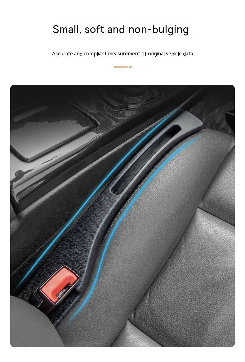 Black plastic car seat gap storage box with handle between vehicle seats