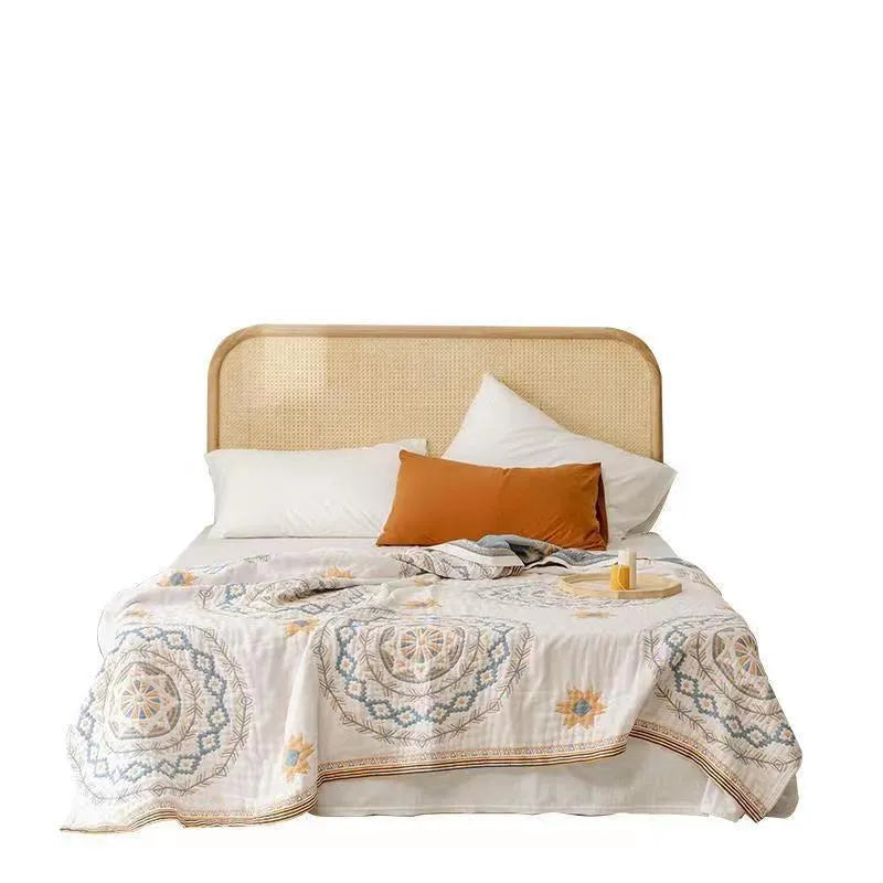 Cotton towel blanket with geometric pattern in modern simplicity style, shown in a home setting.