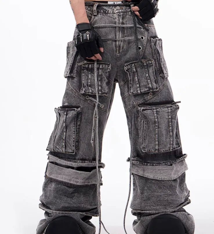 Women's grey distressed denim overalls with mop pant silhouette and rope stitching details