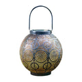 Solar-powered courtyard lamp with hollow iron decorative design showing warm white LED illumination