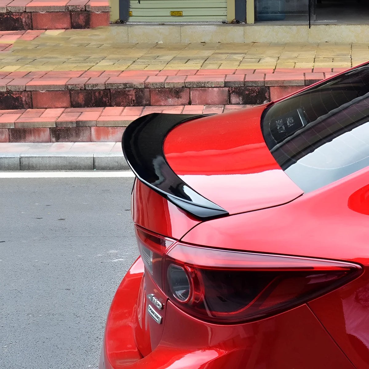 Mazda 3 Axela Exela modified tail trim with large wind surrounded blade in bright black