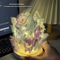 Handmade butterfly night lamp with glass shade and wood base on bedside table
