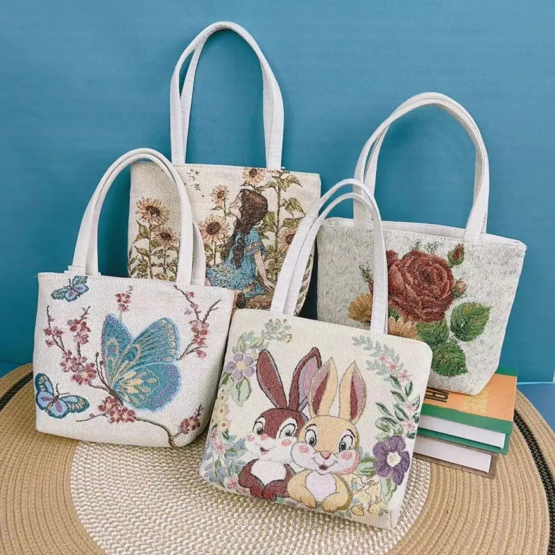 Double-sided gold wire embroidered canvas tote bag in botanical design with polyester construction