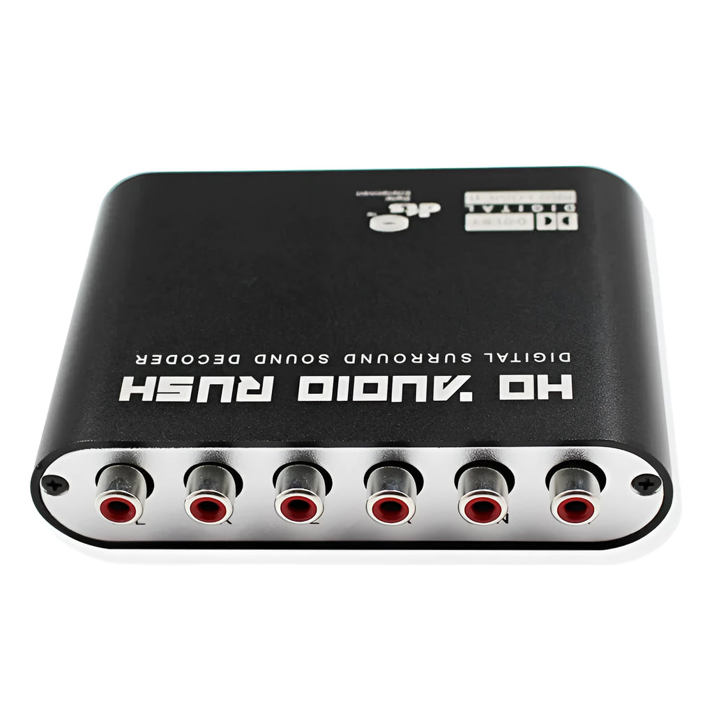 Black DTS Dolby Digital audio decoder with optical and coaxial inputs on a desk