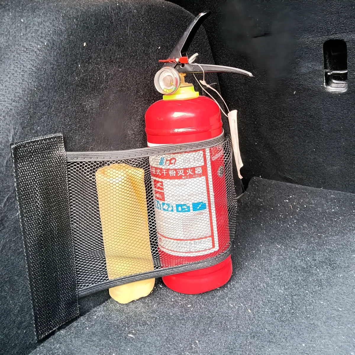 Elastic polyester mesh car boot storage net shown in a vehicle trunk.