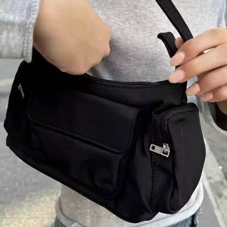Black women's shoulder bag with double pockets and side line detail