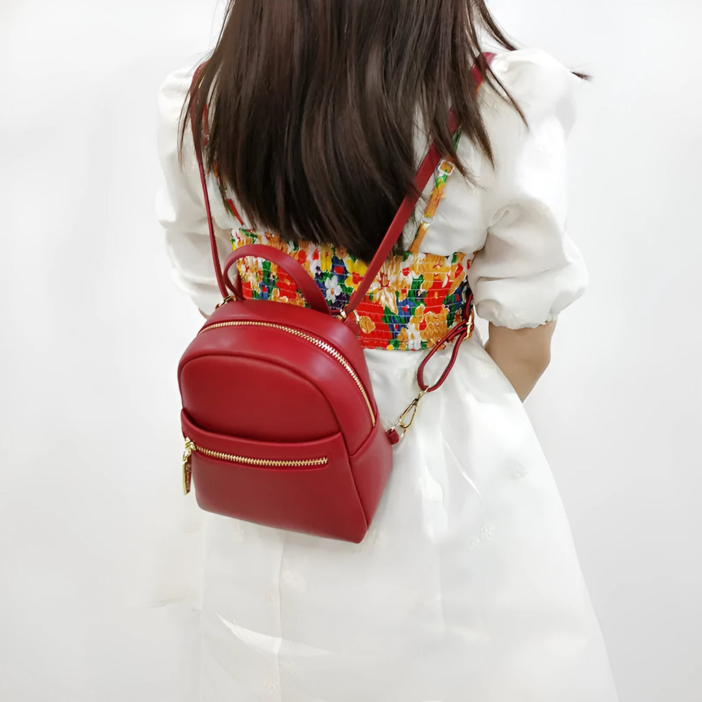 Soft PU mini backpack in street trend style with contrast colour elements and three-dimensional pockets