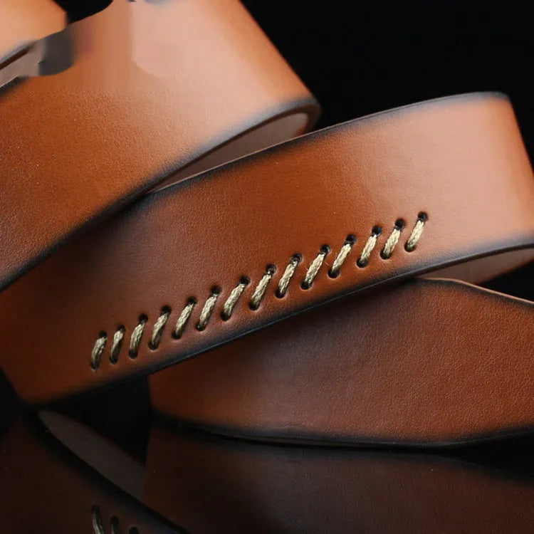 Men's black retro-style pin buckle belt with pattern detail on imitation leather strap.
