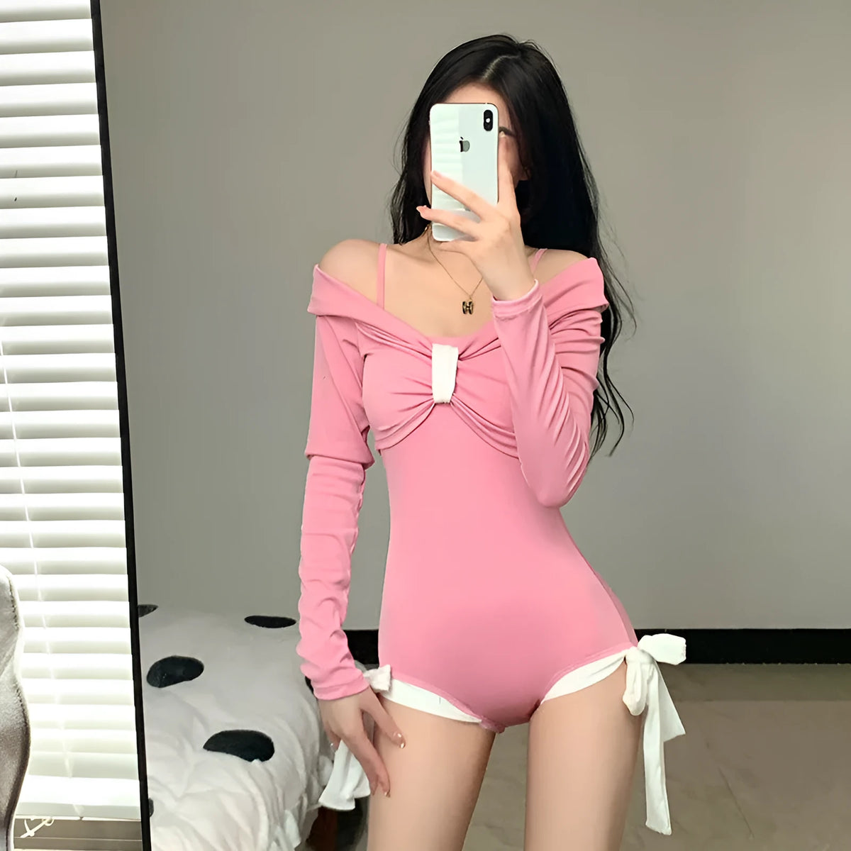 Women's long sleeve one-piece swimsuit in polyester fabric available in pink or black