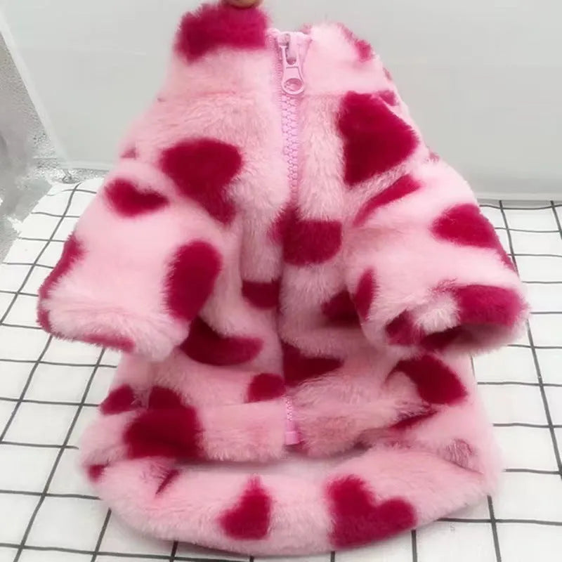 British-style pink warm dog coat for small breed on size chart showing XS to 2XL options