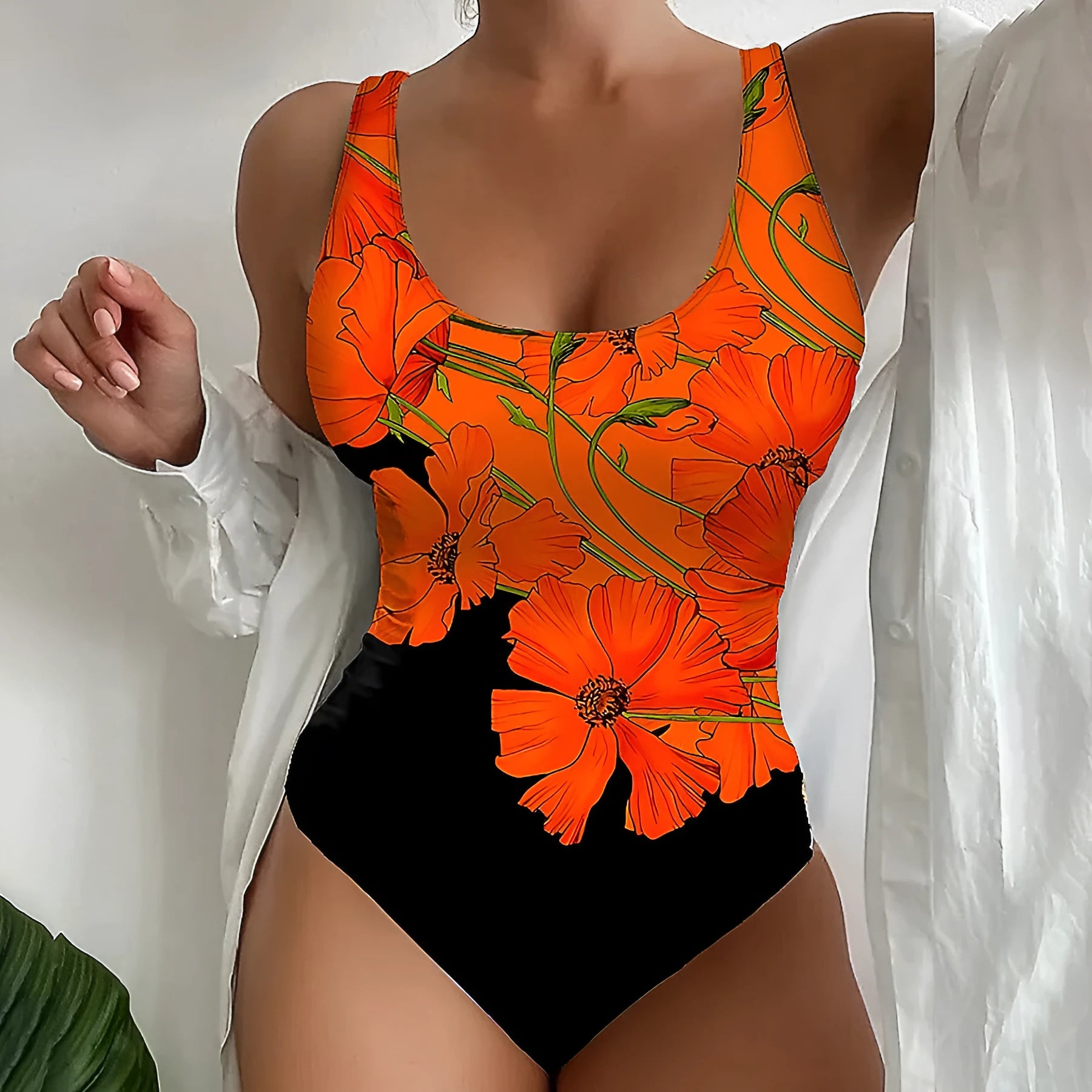 Orange floral print on a backless, slim-fit women's one-piece swimsuit