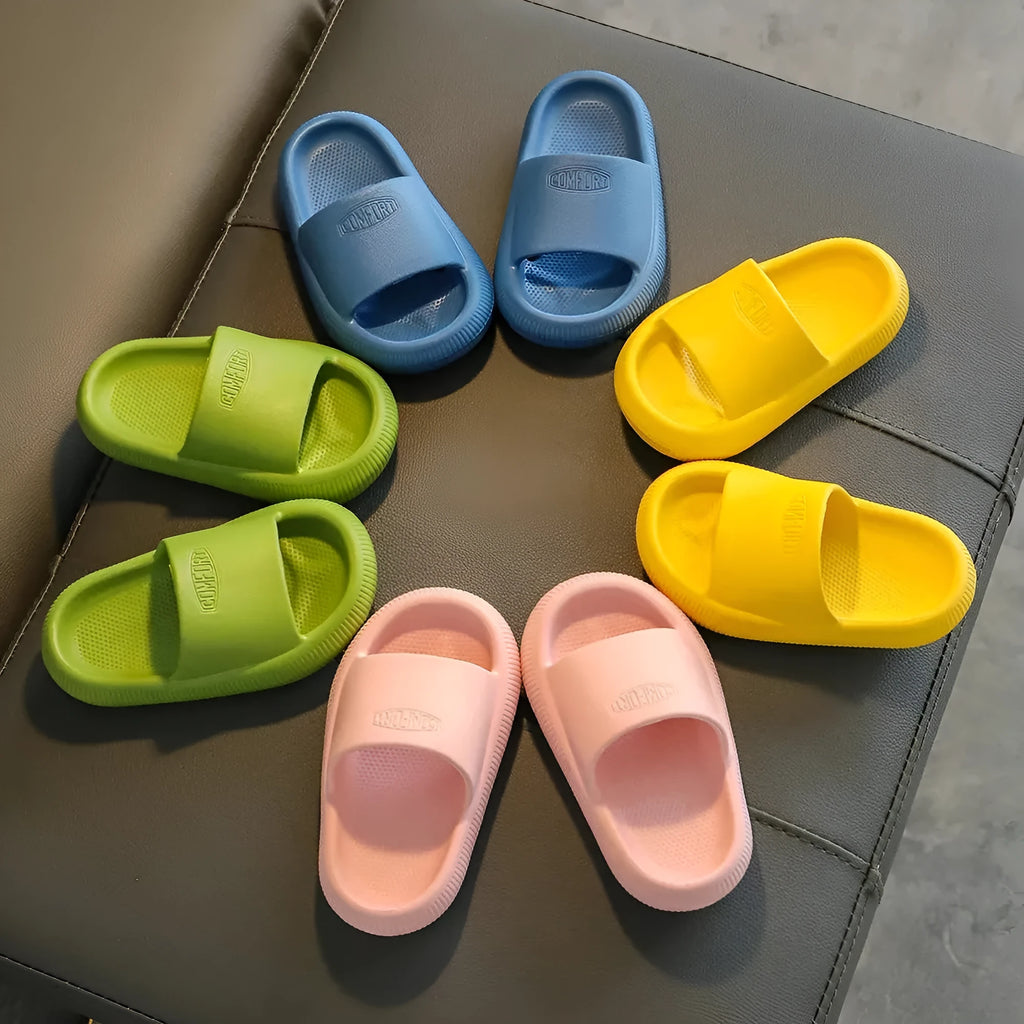Children's mixed colour EVA slippers with non-slip soles showing 1.5cm thickness