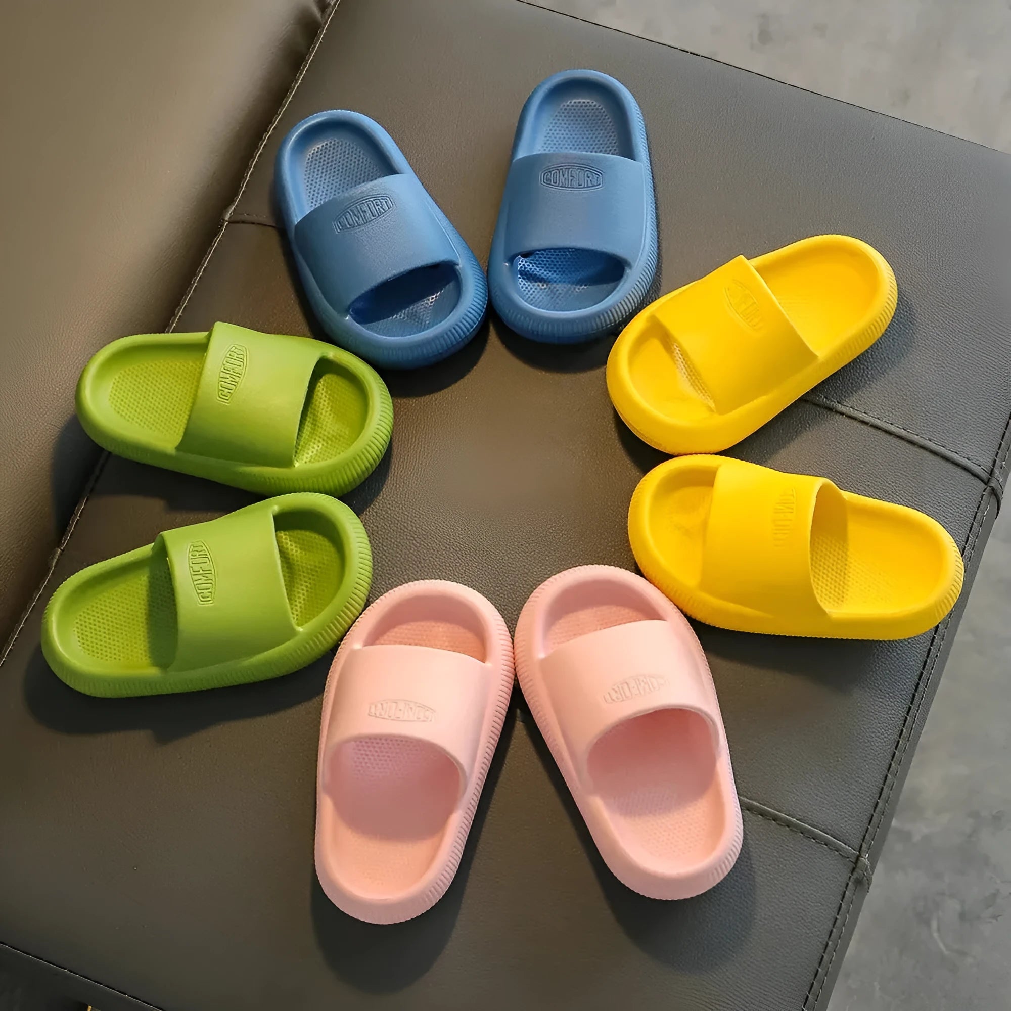 Children's mixed colour EVA slippers with non-slip soles showing 1.5cm thickness
