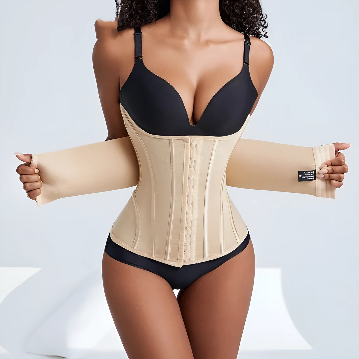 Nylon belly band waist trainer in black and apricot colours showing front view