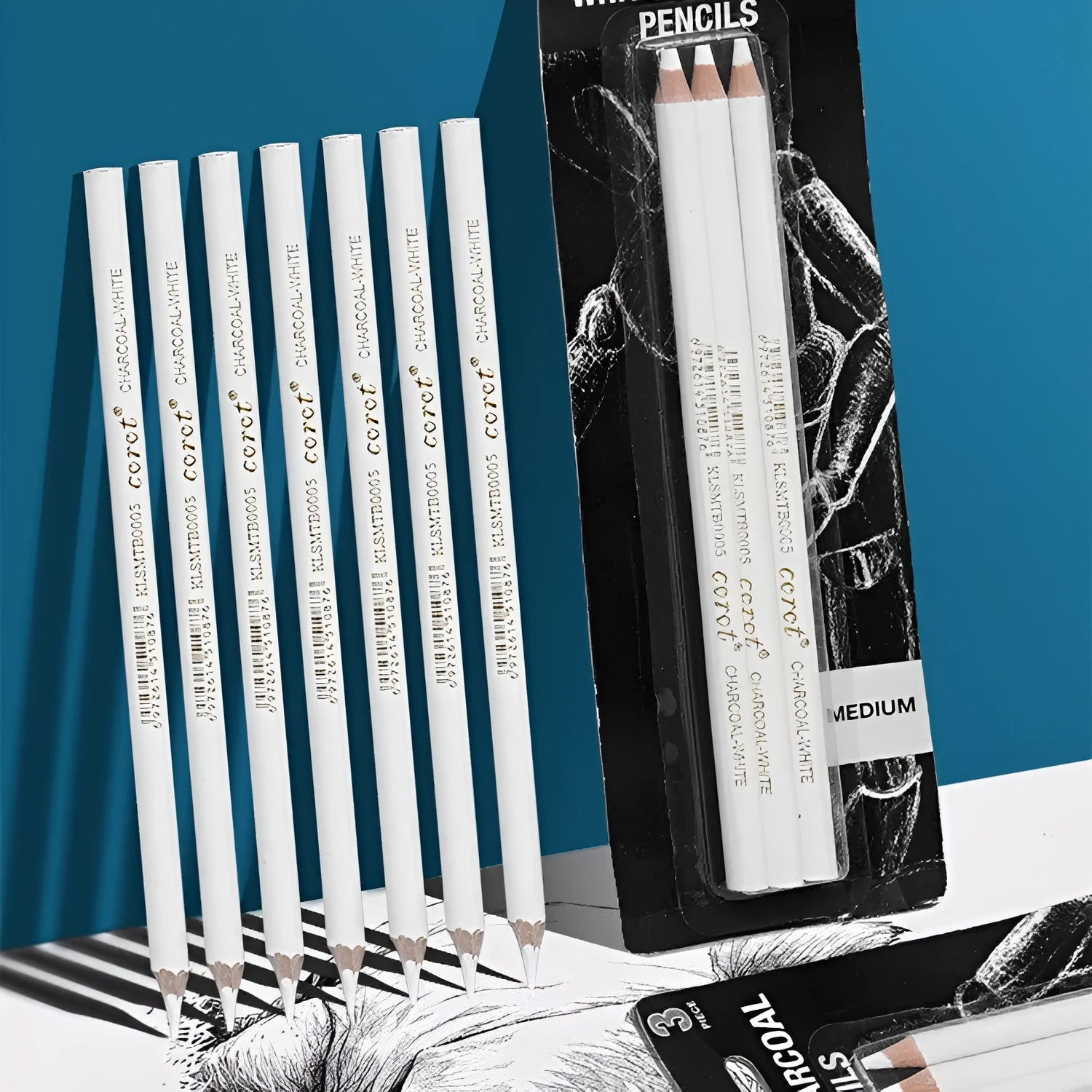 Set of three white charcoal highlighting pencils with wooden shells and brush tips for drawing