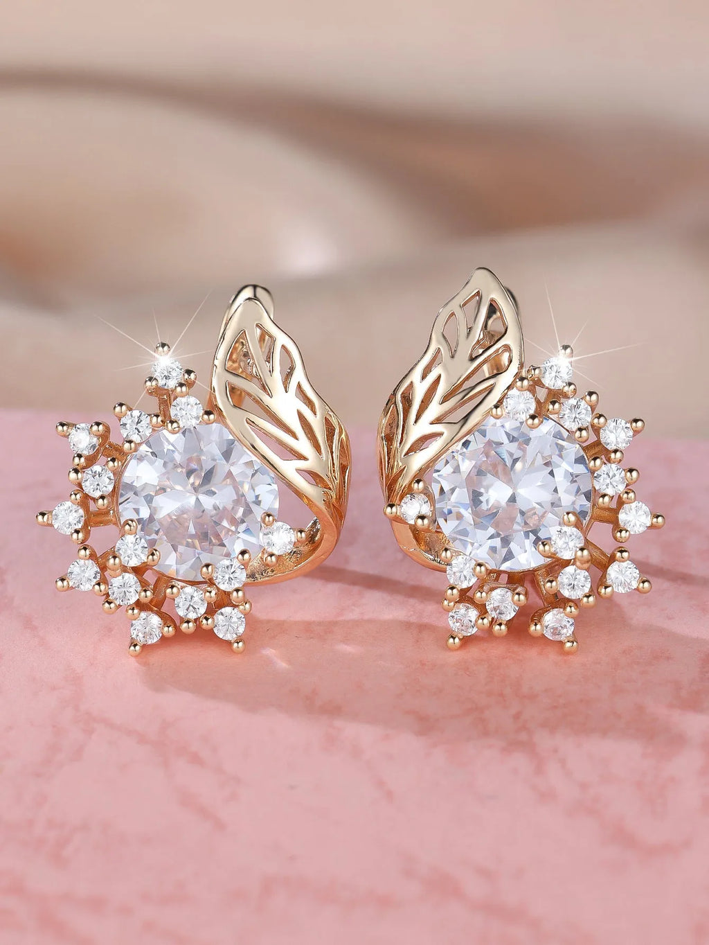 Round flower feather design earrings for women in champagne gold with colourful zircon stone accents.