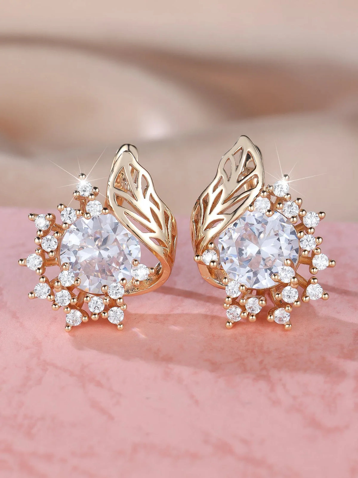 Round flower feather design earrings for women in champagne gold with colourful zircon stone accents.