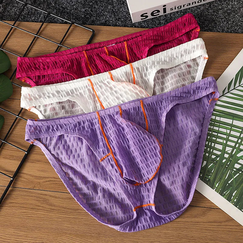 Men's low waist lace briefs in ice silk fabric on solid colour background