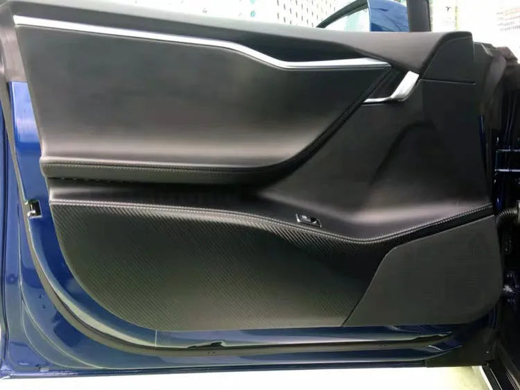 Four-piece carbon fibre pattern protective film kit for Tesla Model S car door interior panels.