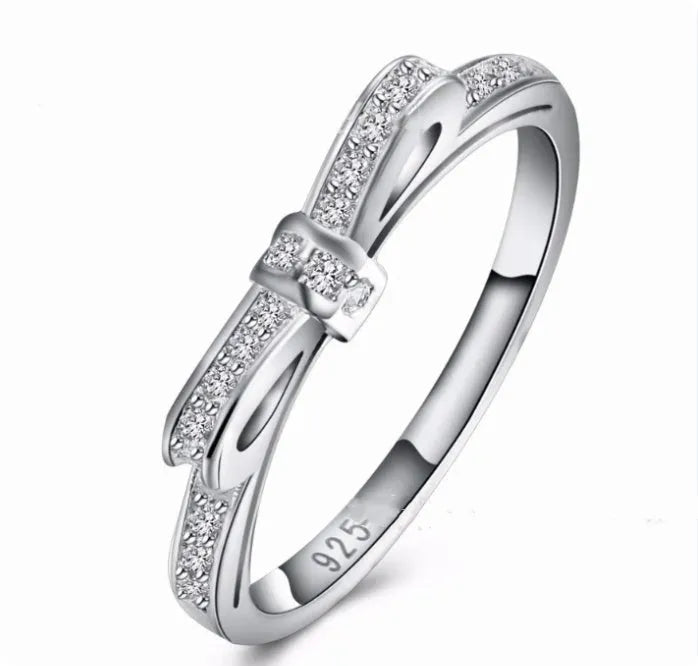 Silver bow-shaped ring with crystal zircon rhinestones in couple style design