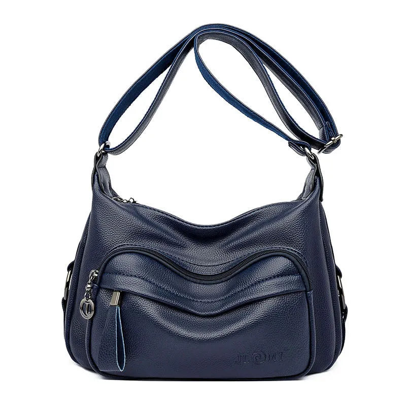 Large black or blue PU crossbody bag with organised internal compartments and soft handle