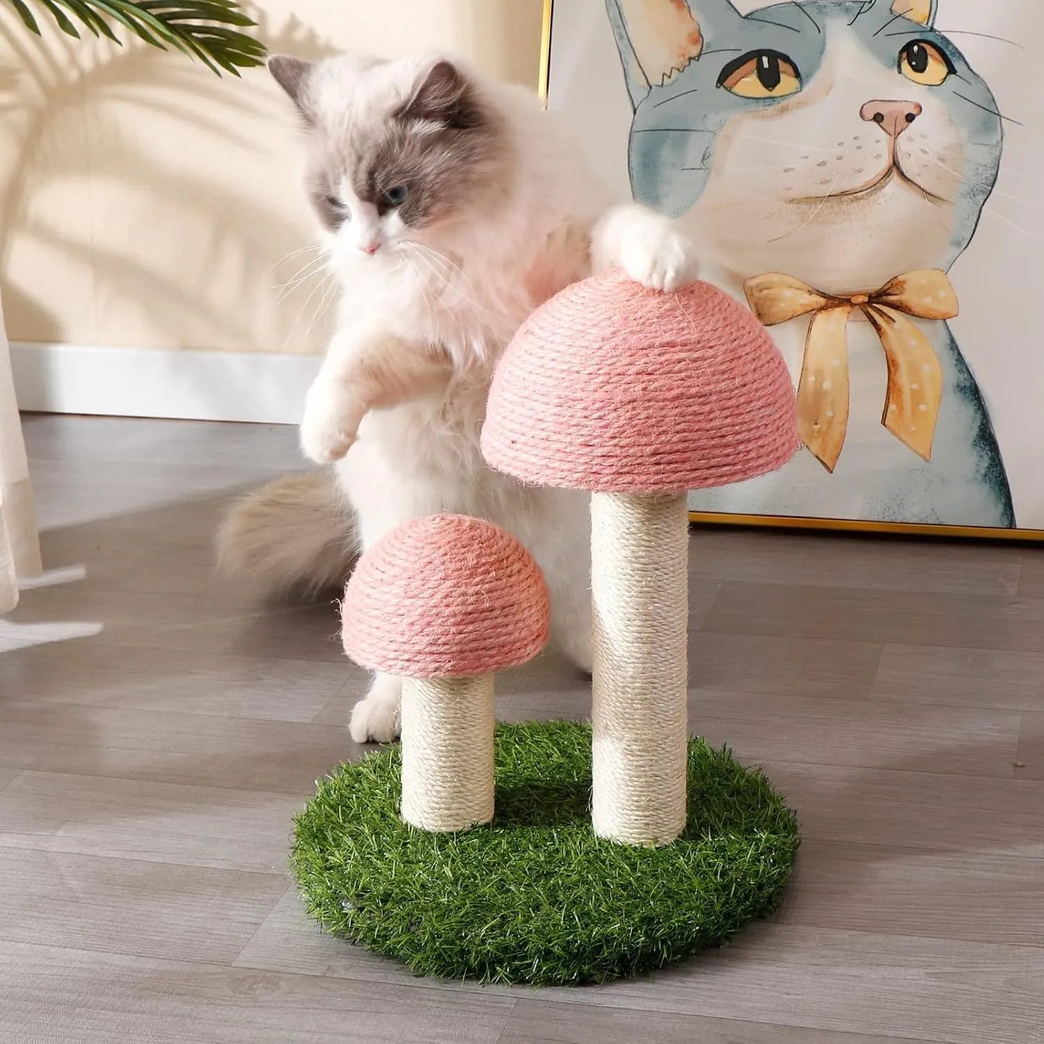 Pink mushroom-shaped cat scratching post with natural sisal cap and pole on a sturdy base.