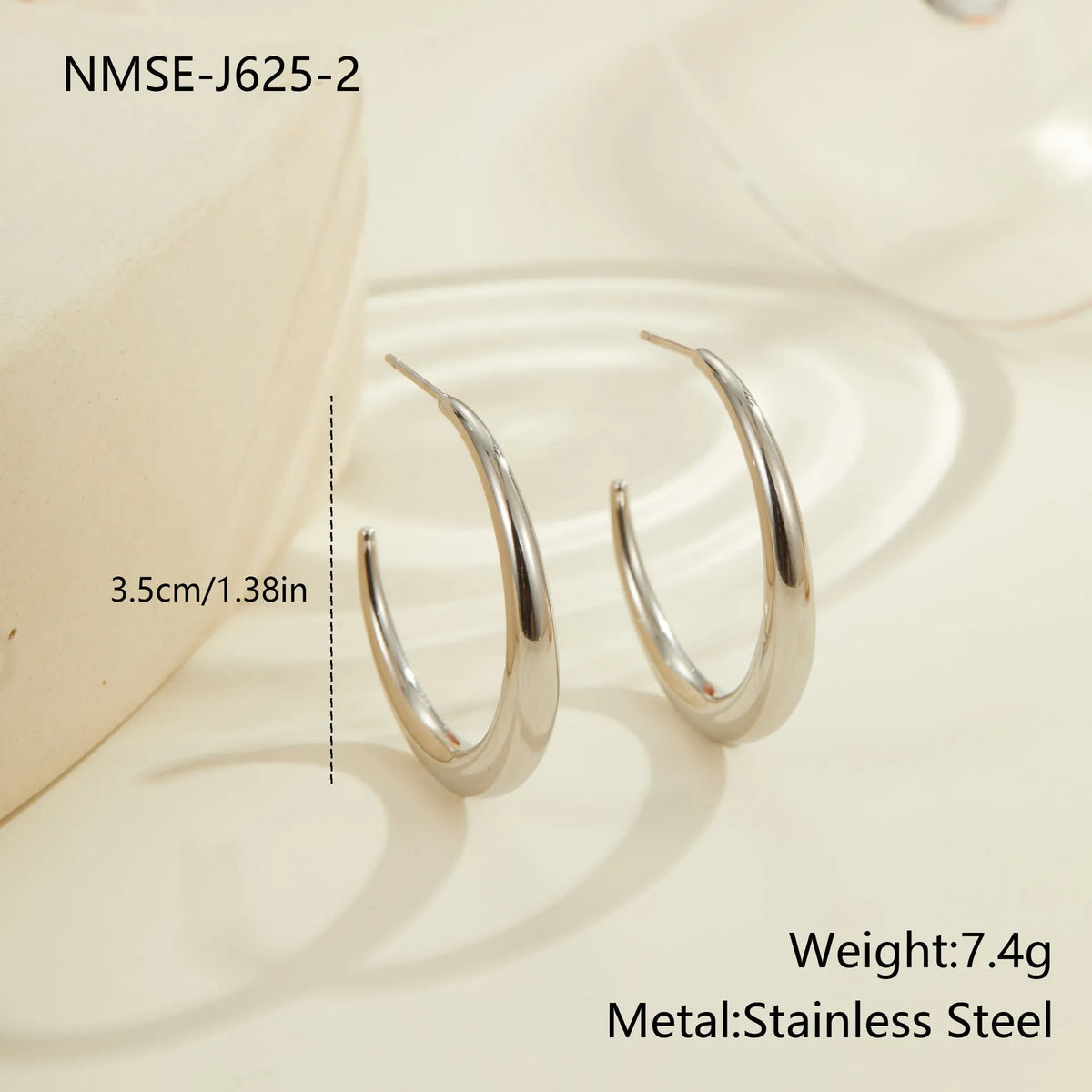Simple geometric round hoop earrings in gold and steel finish made of stainless steel with 18K PVD plating