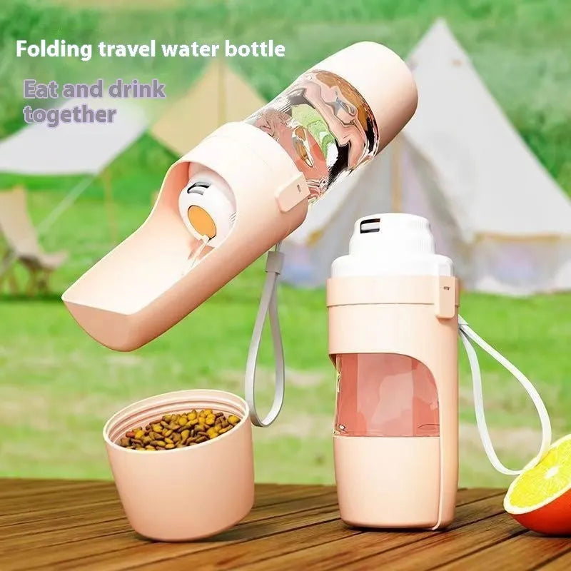 Green 2-in-1 travel dog water bottle and food container with attached lanyard, shown folded.