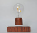 Magnetic levitation floating bulb with imitation wood base and glass enclosure