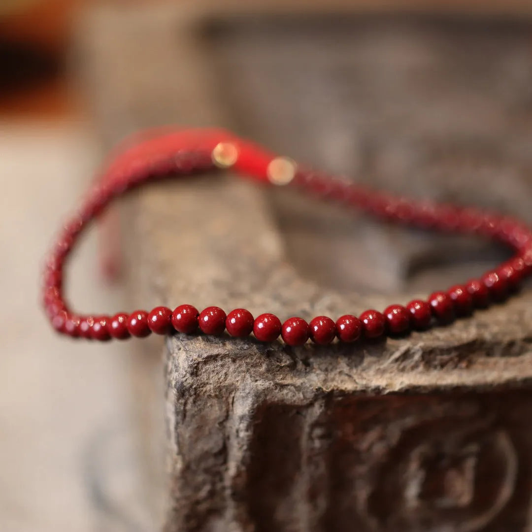 Handcrafted natural cinnabar bracelet with purple gold sand geometric design and auspicious Chinese patterns
