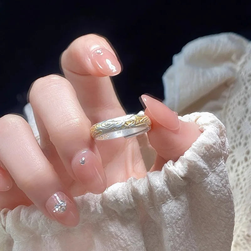 Adjustable open-mouth ring with geometric Xiangyun pattern in silver gold electroplated finish on white copper.