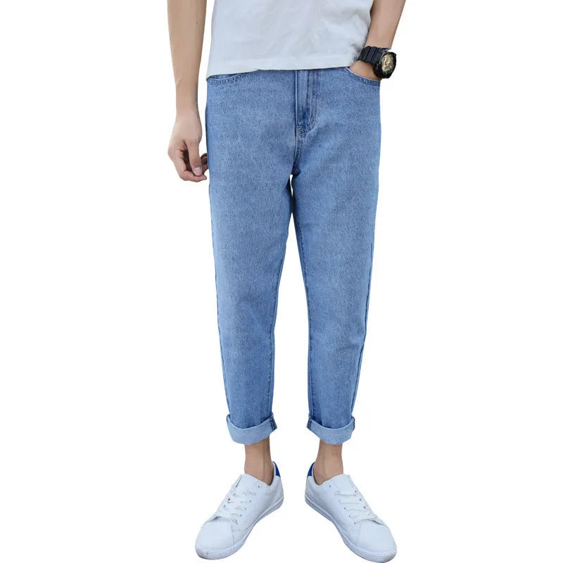 Men's black straight leg jeans with loose harem fit and cotton fabric construction