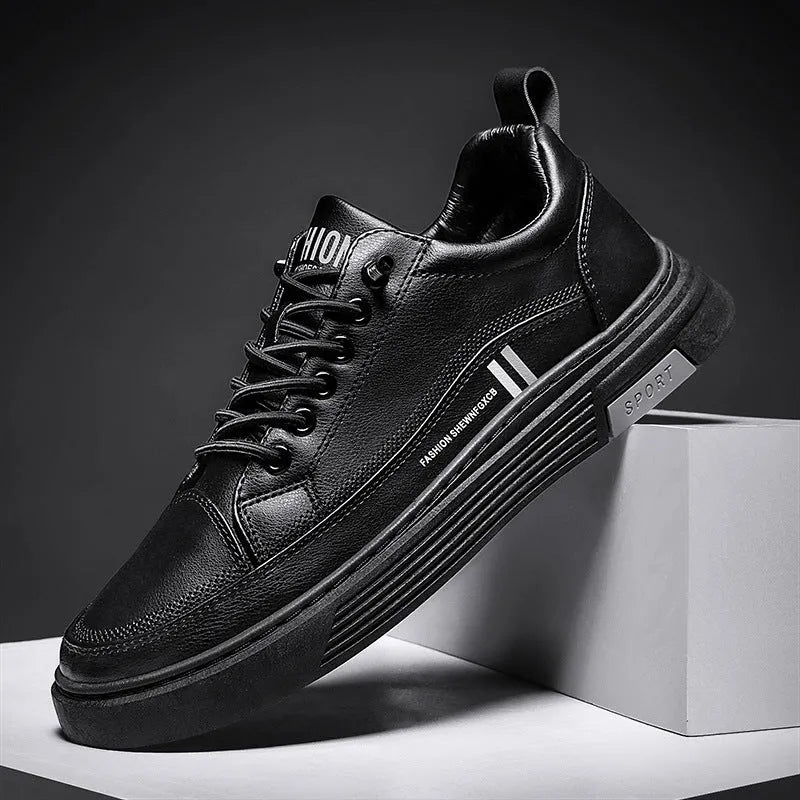 Men's black and white low-top skate shoes with elastic band fastening and rubber sole.