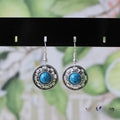 Handmade Miao silver ethnic earrings with geometric turquoise flower disk design