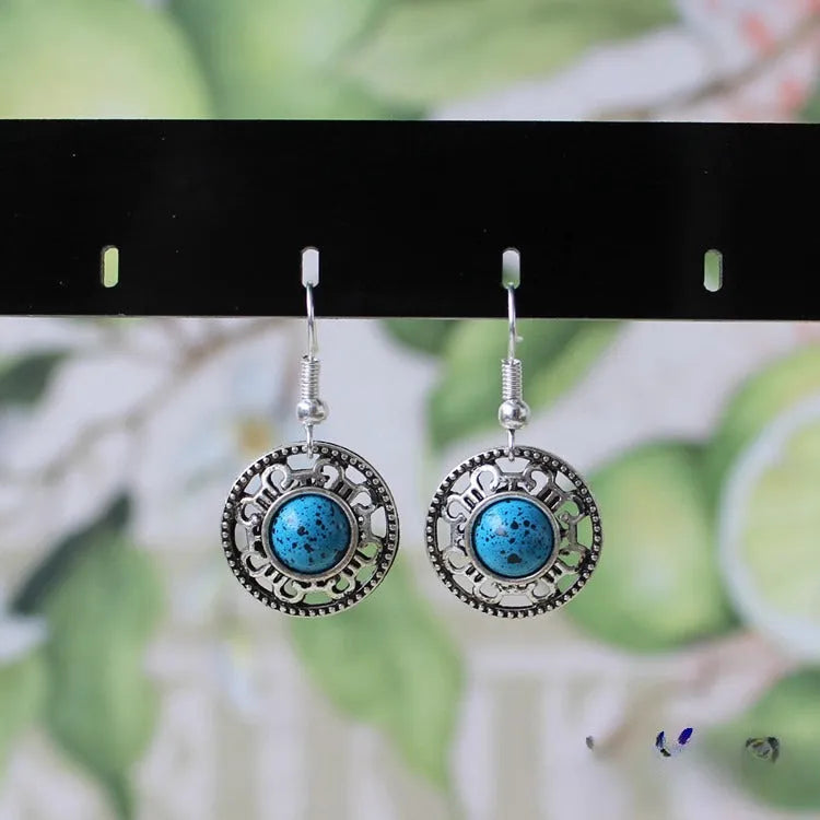 Handmade Miao silver ethnic earrings with geometric turquoise flower disk design