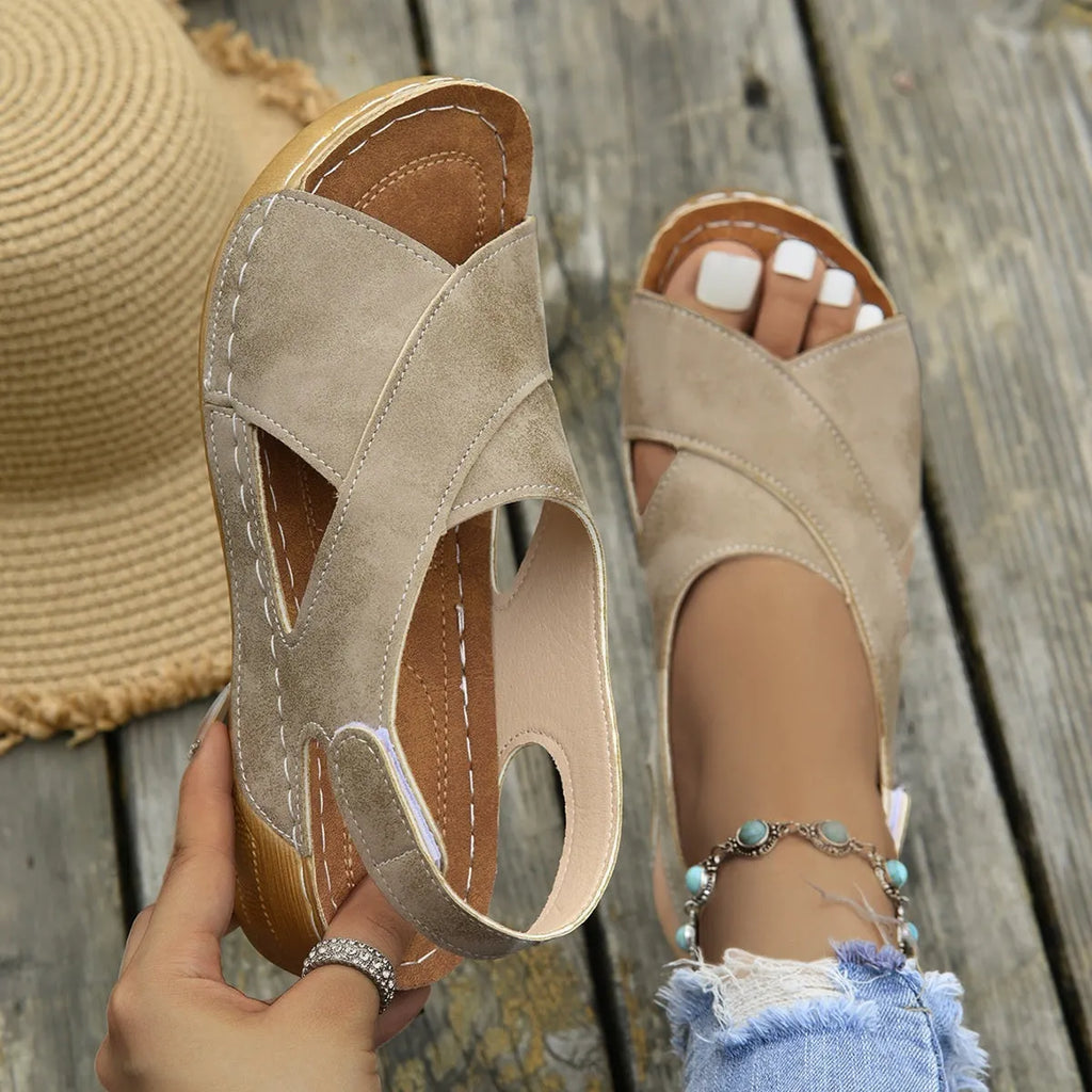 Roman platform sandals with skirt detail showing adjustable Velcro strap and open toe design