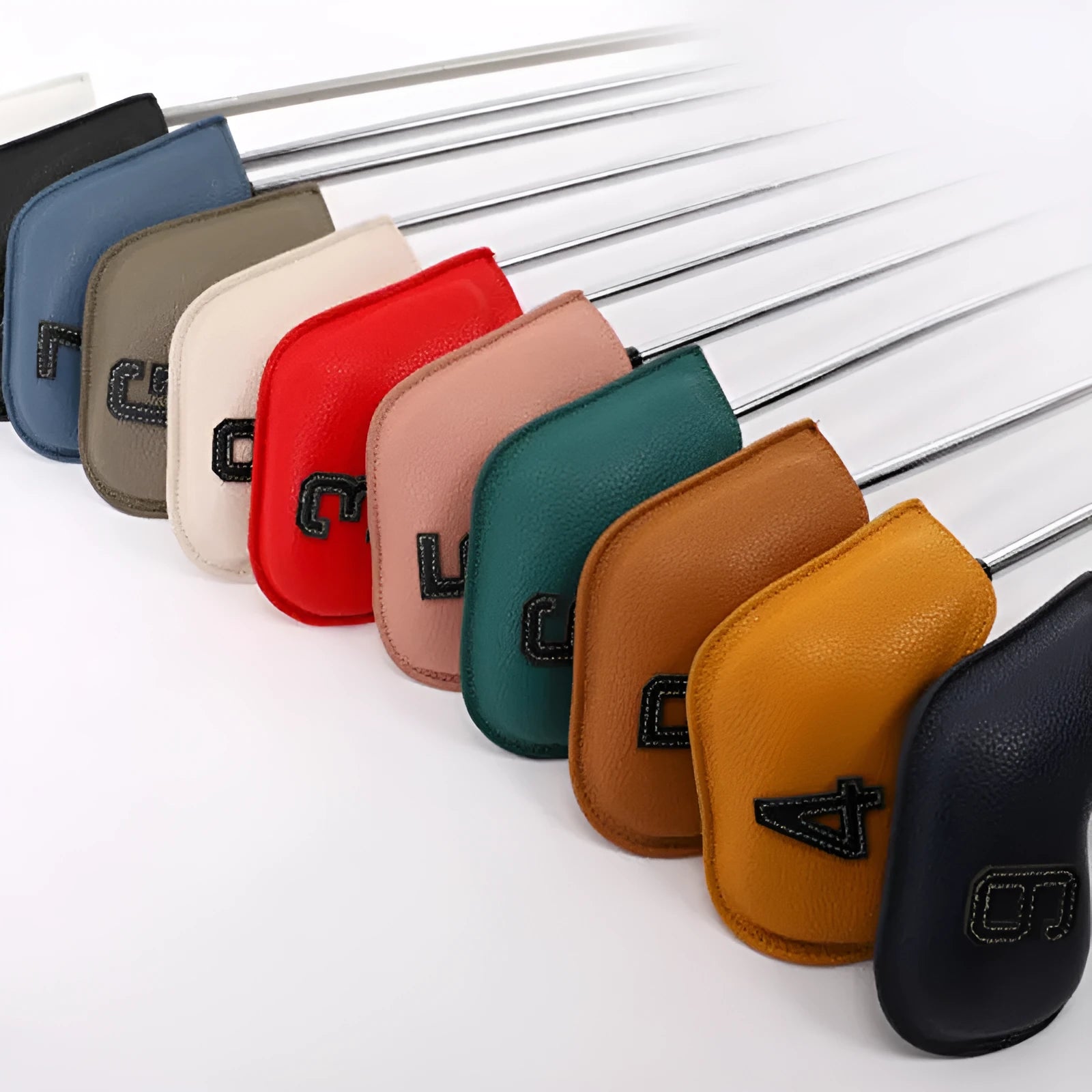 Set of ten colourful digitally printed golf club head covers for woods and irons.