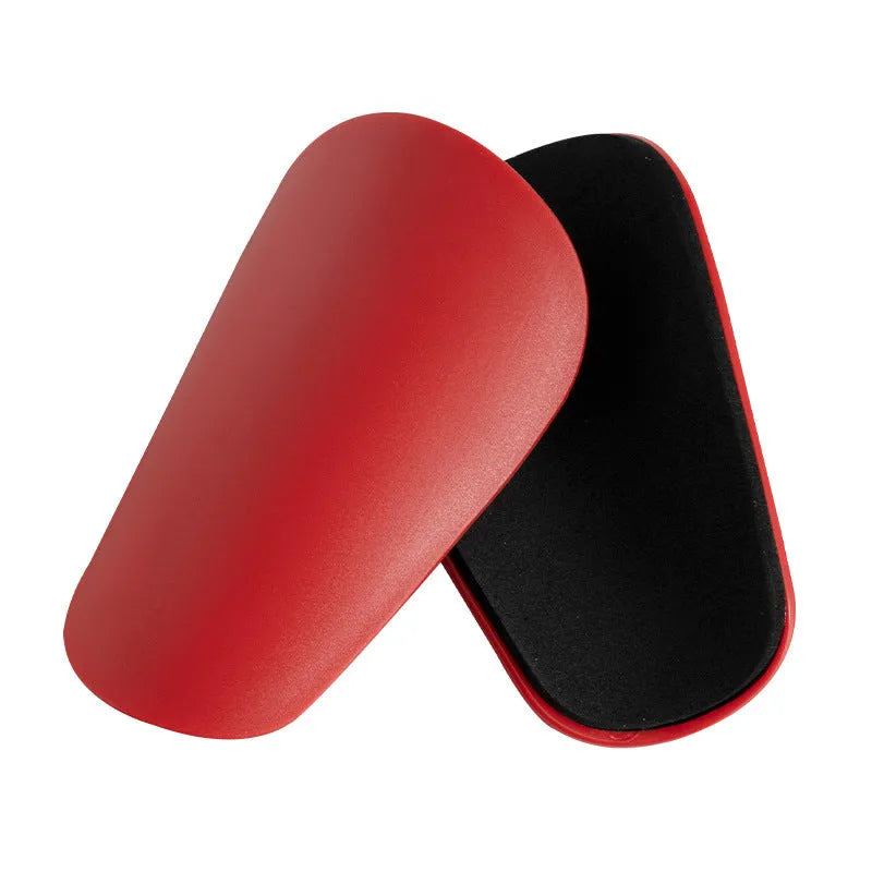 PU mini shin guards in black, white, red and blue for football and outdoor sports