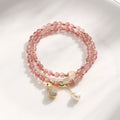 Women's geometric strawberry quartz crystal bracelet for money drawing and luck.