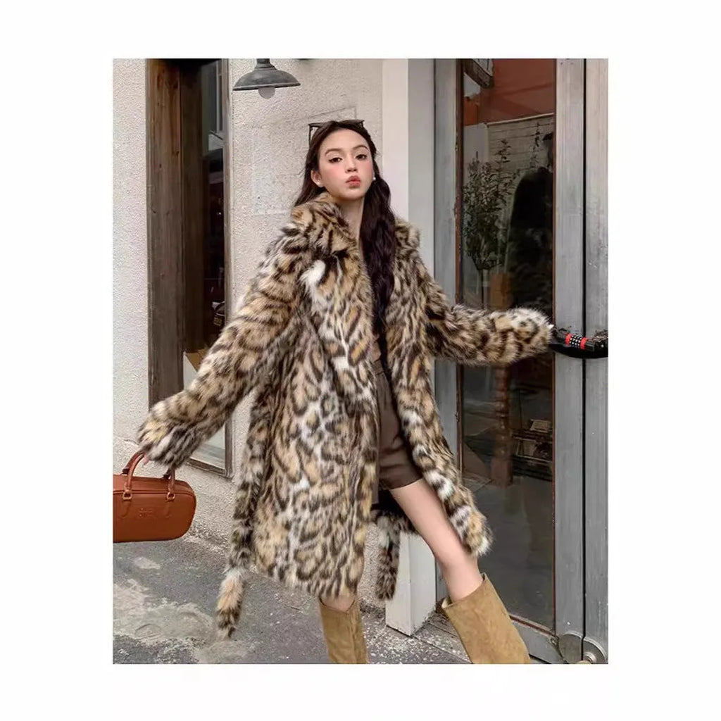 A street-fashion faux fur coat with a fox print pattern and a fur collar, shown in a long style.