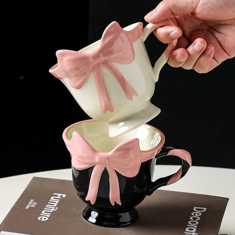 Ceramic heart bow design mug in white powder or black pink colour with 301-400ml capacity