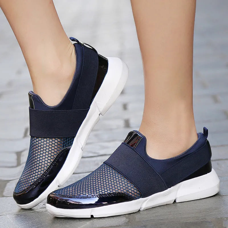Low-top women's casual sneakers in blue, black, or grey with a mesh lining and textured sole.