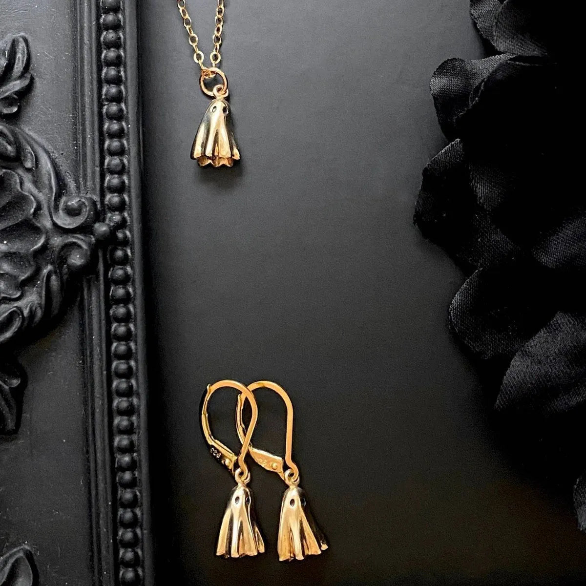 A titanium steel ghost pendant necklace on a choice of stainless steel chain styles.