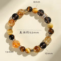 Natural yellow 10mm Jinba crystal beads on a handmade wrap bracelet.